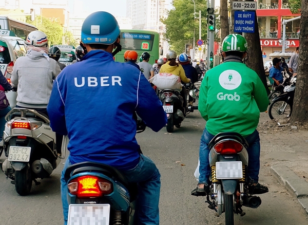Gần một năm Uber về tay Grab (Ảnh: Internet)