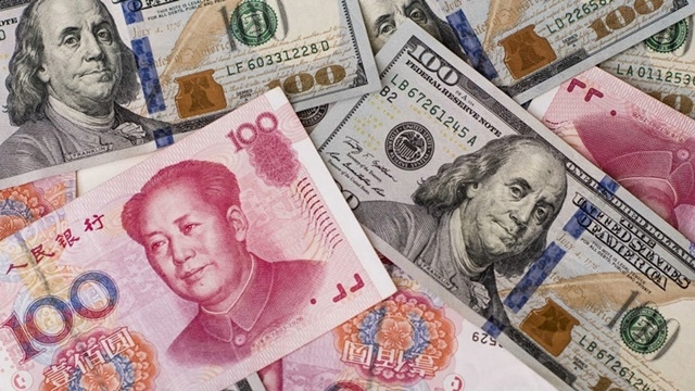 Tại các ngân hàng thương mại, sáng nay 26/9, giá USD ổn định và giá đồng Nhân dân tệ (NDT) giảm.(Ảnh Internet)