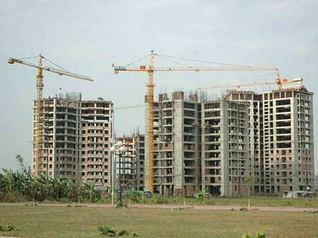 Theo Bộ Xây dựng việc điều chỉnh mức thuế giao dịch bất động sản góp phần làm thị trường bình ổn (Ảnh: Interntet)