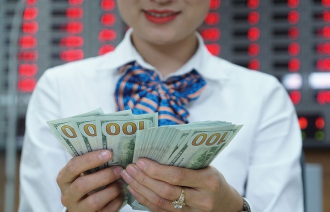 Tỷ giá USD tăng 0,452 điểm so với cùng thời điểm giao dịch ngày 13/10. (Ảnh: Int)