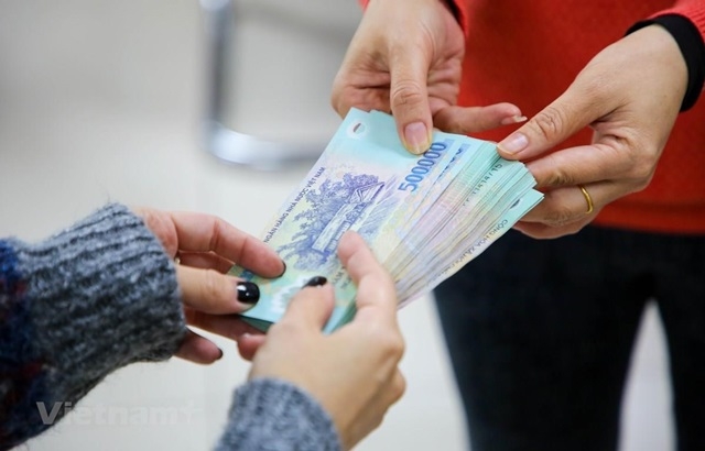 Thưởng Tết Tân Sửu 2021 bình quân giảm 5% do ảnh hưởng của COVID-19 (Ảnh Int)