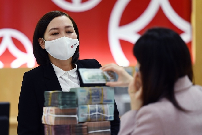 Ngành ngân hàng triển khai nhiều giải pháp để tăng trưởng tín dụng trong bối cảnh dịch Covid-19 gây khó khăn cho hoạt động sản xuất kinh doanh của doanh nghiệp.