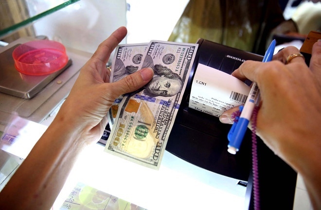 Giá bán USD liên tục giảm trong thời gian gần đây. (Ảnh: Int)