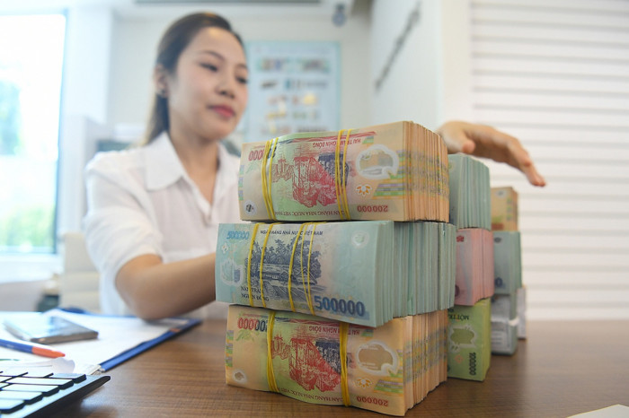 Các ngân hàng vẫn có thể giảm lãi suất cho vay để hỗ trợ doanh nghiệp và nền kinh tế nếu chấp nhận hy sinh một phần lợi nhuận. Ảnh Int