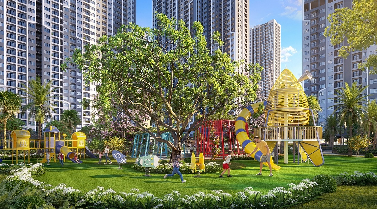 Khu vui chơi trẻ em ngoài trời rợp bóng cây xanh.