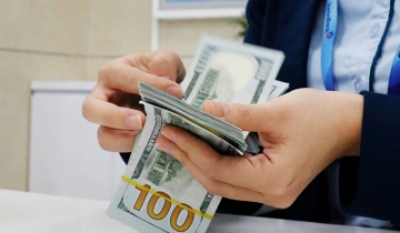 Các tổ chức quốc tế nhận định áp lực tỷ giá trong tầm kiểm soát